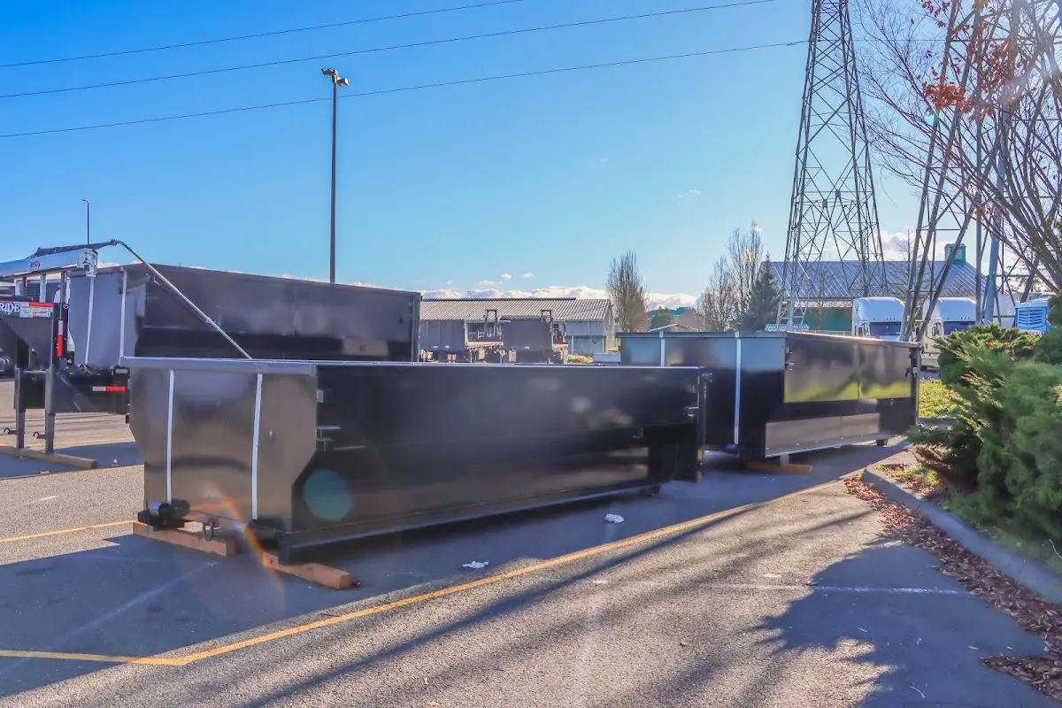 Roll-off dumpster ready for waste disposal at job site for 2 Yard Dumpster Rental in Lumberton